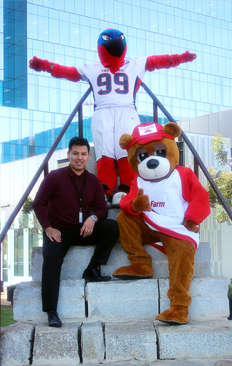 Brian Perez with Thunderbird, the Mesa Community College mascot and Bear, the State Farm mascot.