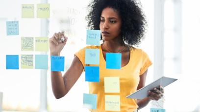 A woman goal-setting at work. 