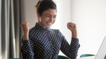 An employee celebrating reaching her professional goals