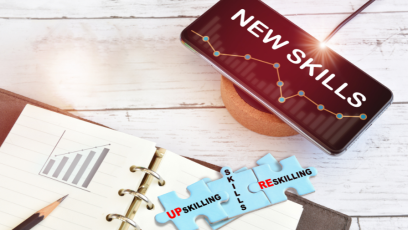 Puzzle pieces with the words upskilling, skills and reskilling. 