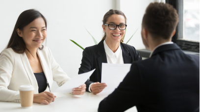 Two recruiters interviewing a man for a job