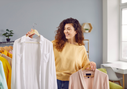 A woman choosing her clothing for an interview.