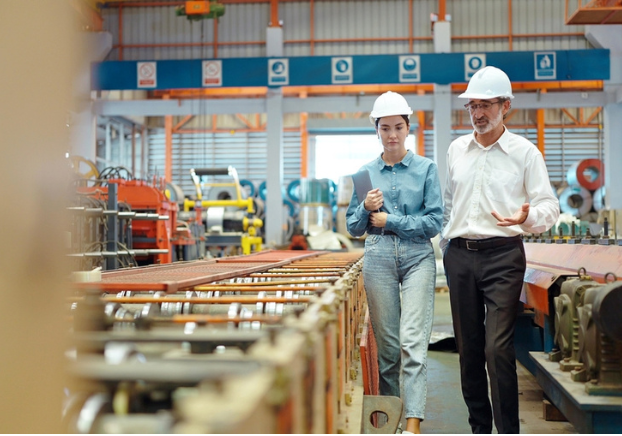 Manager walking through manufacturing floor