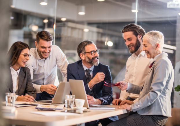 Group of business professionals gathered around a table talking